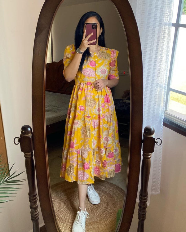  Cotton Suit yellow floral cotton dress for women with puff sleeves and midi length worn with white sneakers